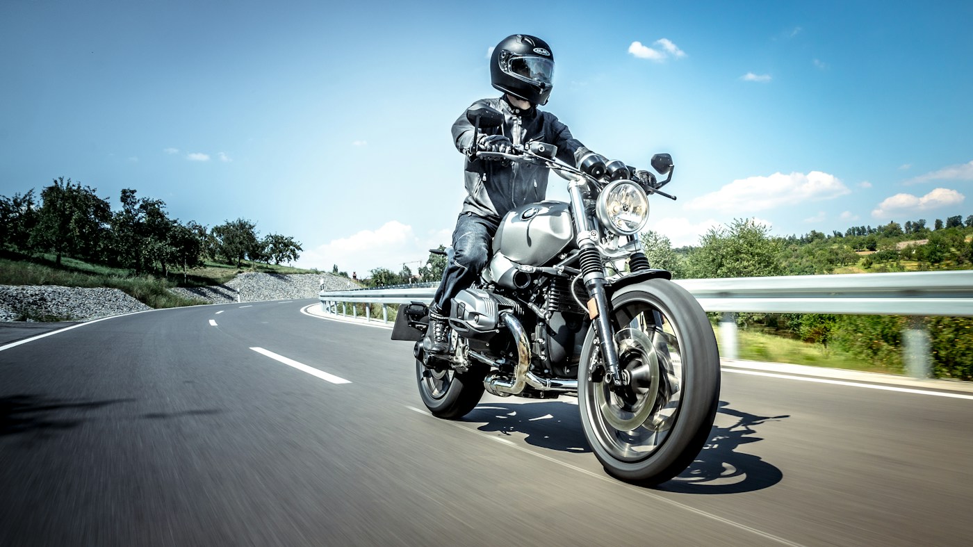 Motorcyclist riding on an open road